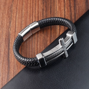 Handwoven black leather bracelet with silver metal magnetic clasp and cross charm detail