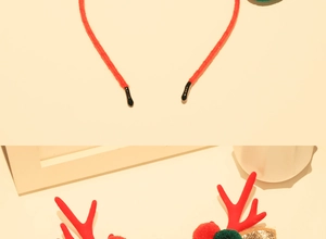 Detail of red Christmas reindeer antler headband with plush mink fur and glitter
