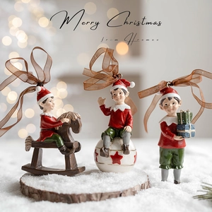 Three vintage 3D Christmas elf resin ornaments with red and green festive costumes