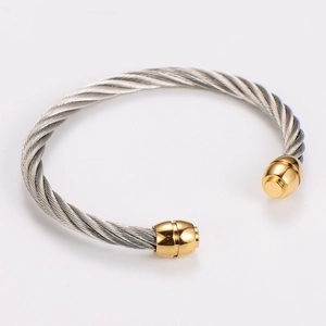 Detailed macro view of two-tone braided stainless steel cable wire cuff bracelet