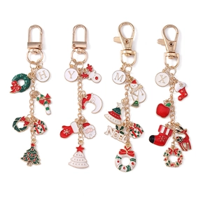 Christmas enamel keychains with letters and festive charms on gold metal chain