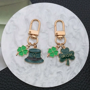 St. Patrick's Day shamrock and green hat enamel keychains in gold finish
