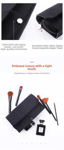 Detail of waterproof nylon makeup brush bag with elastic loops and smooth zipper closure