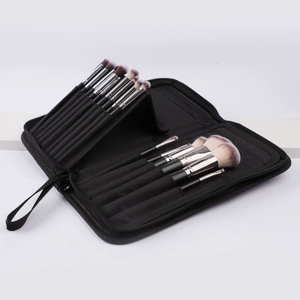 Macro detail of the internal elastic slots inside the black makeup brush organizer bag