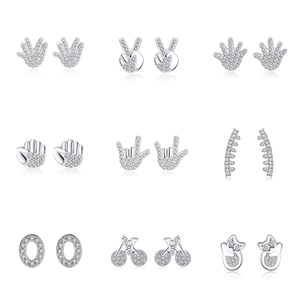 Detailed grid of 9 pairs of silver 925 earrings with diverse symbols and sparkling zircons