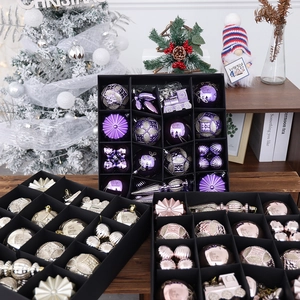 Assorted Christmas ball ornaments in purple, gold, and rose gold with festive patterns