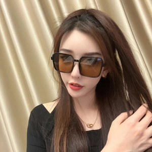Fashionable oversized black square frame sunglasses with brown gradient lenses for women