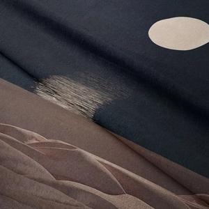 Close-up of abstract mountain landscape tapestry with velvet texture in navy and beige