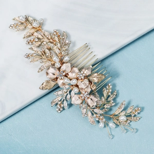Handmade gold bridal hair comb with elegant metal leaves, pearls, and rhinestones