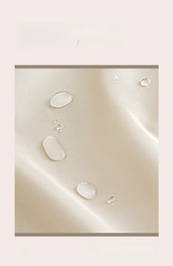 Close-up of waterproof and oil-proof fabric showing water droplets on the apron surface