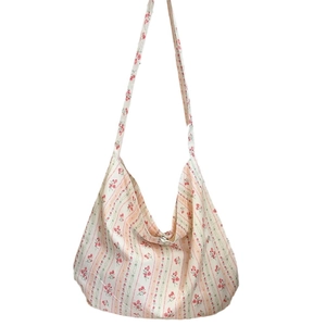 Stylish leopard print crossbody canvas bag with high capacity and floral pattern detail