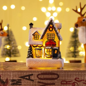 Lighted Christmas candy shop house decoration with warm LED glowing lights and glitter snow
