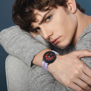Lavender silicone strap on Samsung Galaxy watch shown on wrist with black buckle