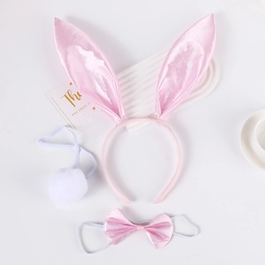 Three-piece bunny ear set including pink satin headband, bow tie, and plush tail detail