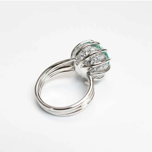 Detailed macro view of paraiba green gemstone ring with sparkling side stones