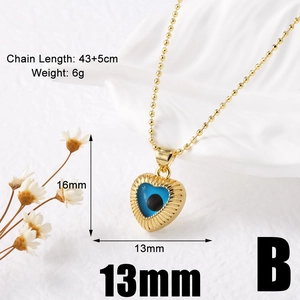 Detail of 18k gold plated heart pendant with blue eye zircon, 16x13mm size