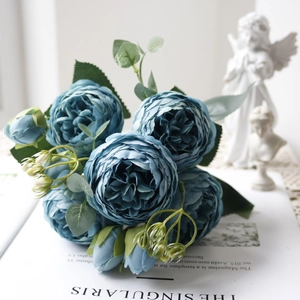 Close-up of blue silk peony bouquet with layered petals for elegant home decor