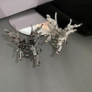 Chic butterfly metal hair claw clips in silver and gun black with a liquid lava design