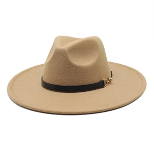 Detailed macro view of khaki wool fedora hat with black belt and gold buckle accent