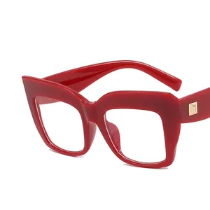 Oversized red cat eye eyeglasses frame with anti-blue light clear lenses and gold detail