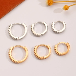 Set of three sizes gold and silver hoop earrings with cubic zirconia pave stones