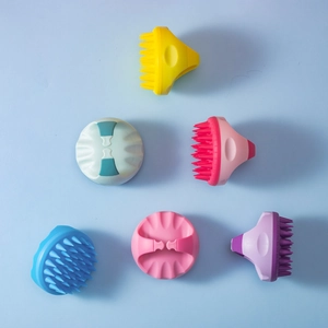 Silicone scalp massage brushes in six vibrant colors with ergonomic grip handles