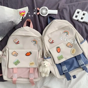 Detail view of Japanese style school backpack with colorful badges and buckles