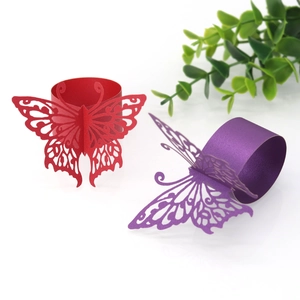 Detail of laser-cut butterfly paper napkin rings in red and purple colors