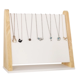 Minimalist solid wood necklace display stand with white padded surface for jewelry storage