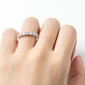 Elegant 925 sterling silver seven-stone moissanite row ring displayed on a model's finger
