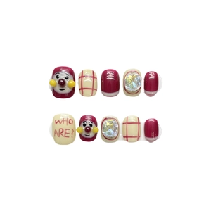 Handmade red cartoon press-on nails with Anpanman style hand-painted art and rhinestones