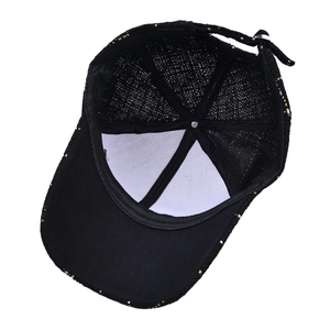 Internal view of plaid baseball cap with gold thread weave and adjustable buckle