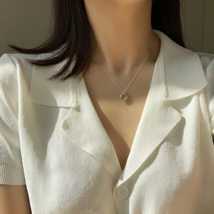 Detail showing 925 sterling silver interlocking double circle pendant necklace on neck