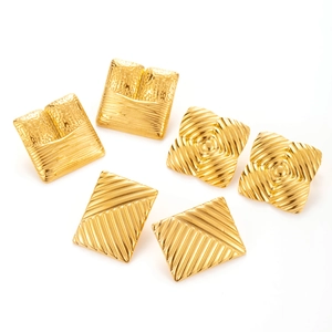 Three pairs of geometric gold earrings with square texture and irregular metal patterns