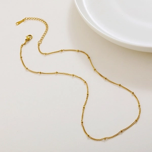 Polished gold satellite chain necklace with delicate beads and lobster clasp closure