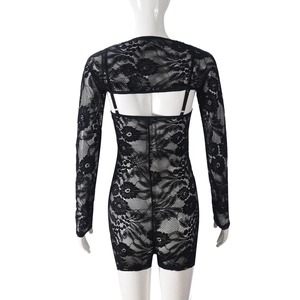 Detail of floral lace texture on back of black long sleeve form-fitting bodysuit