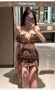 Detail of leopard print two-piece lingerie set with halter neck top and drawstring mini skirt