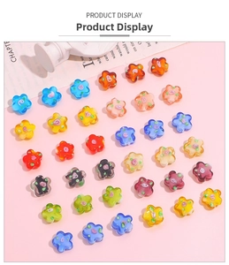 Detailed view of colorful flower-shaped glass beads for handmade jewelry DIY projects