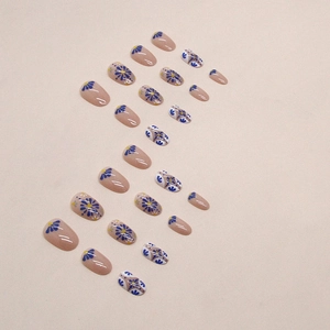Short oval teal and daisy pattern press-on nails set with minimalist floral art design
