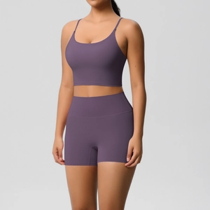 Detailed close-up of dark purple seamless yoga set showing high-waist shorts and thin straps