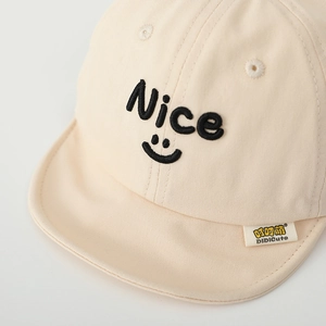Close-up of Nice embroidery and soft cotton fabric on this beige baby baseball cap