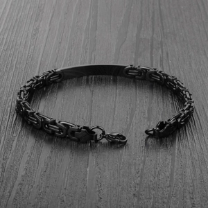 Macro shot of matte black Byzantine chain bracelet with blank metal ID plate