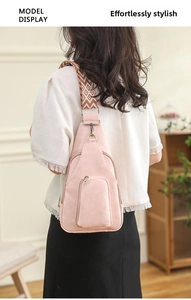 Pink PU leather crossbody chest bag featuring floral jacquard strap and dual zip pockets