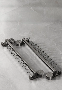 Detail of space aluminum kitchen rack with multiple hooks and suction cups