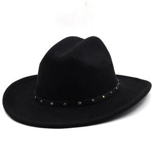 Detail of black felt cowboy hat featuring leather band with gold and silver metal rivets