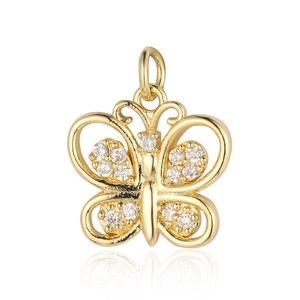 Detailed view of a gold hollow butterfly pendant with zircon inlay and studio reflection
