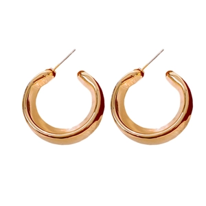 Minimalist wide gold C-shaped hoop earrings with a polished finish and elegant design