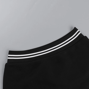 Close-up of elastic waistband with white stripes on sporty black baseball skirt