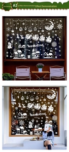 White Christmas window decals featuring Santa, reindeer, and snowflakes for glass decor