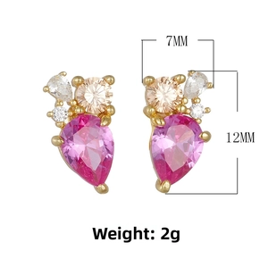 Detailed close-up of 12x7mm teardrop pink zircon earrings with golden prong settings